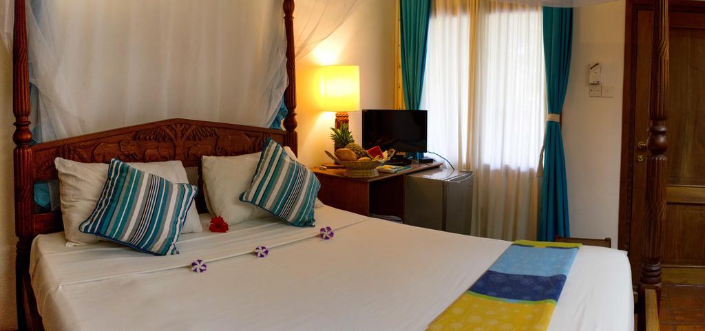 Mangro Hotel Playa de Diani Habitación foto